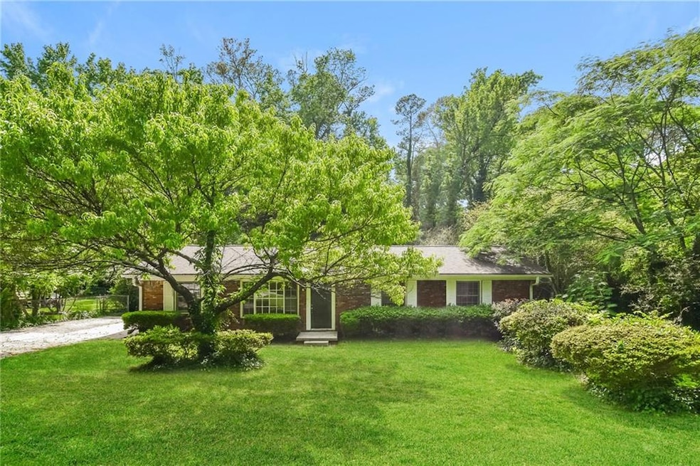 View of front of property with a front lawn and br