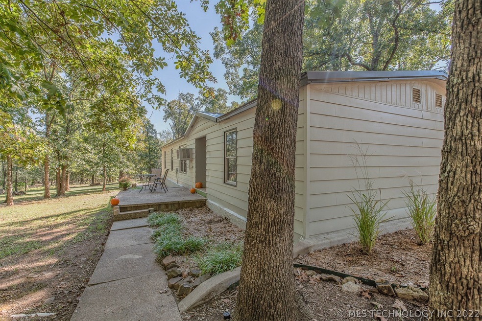 Sidewalk and large porch overlooking the property