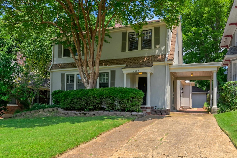 Front of home with porte-cochere.  There is also a