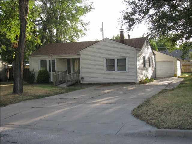 Ranch with one car detached garage + workshop