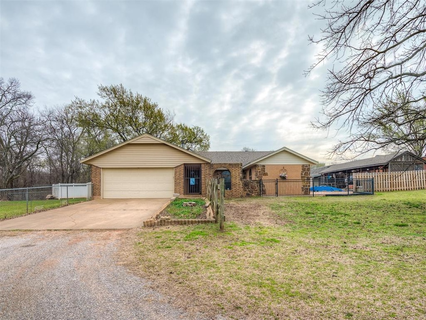 Ranch-style house with brick siding, concrete driv