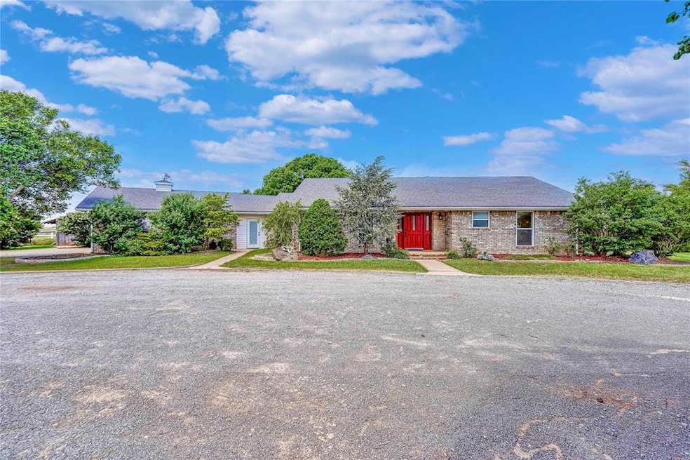 Single story home with brick siding