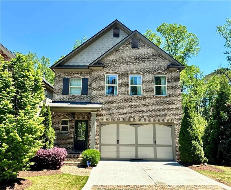 View of front of property featuring a garage and a
