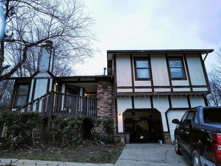 View of front facade featuring a garage