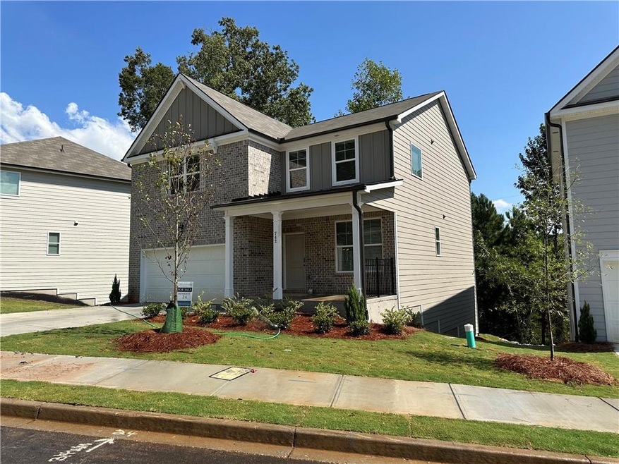 View of front of property with a garage and a fron