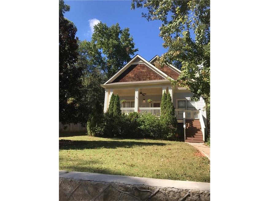 Flat sun filled front yard and mature landscaping