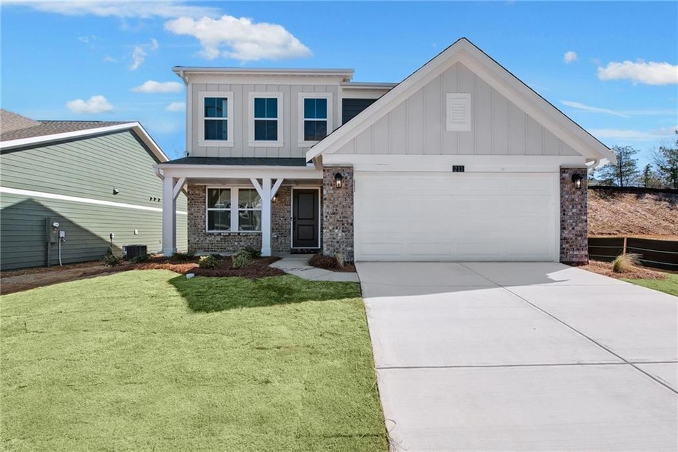 View of front of home with driveway, cooling unit,