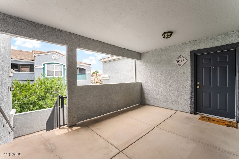 Doorway to property with stucco siding and a balco