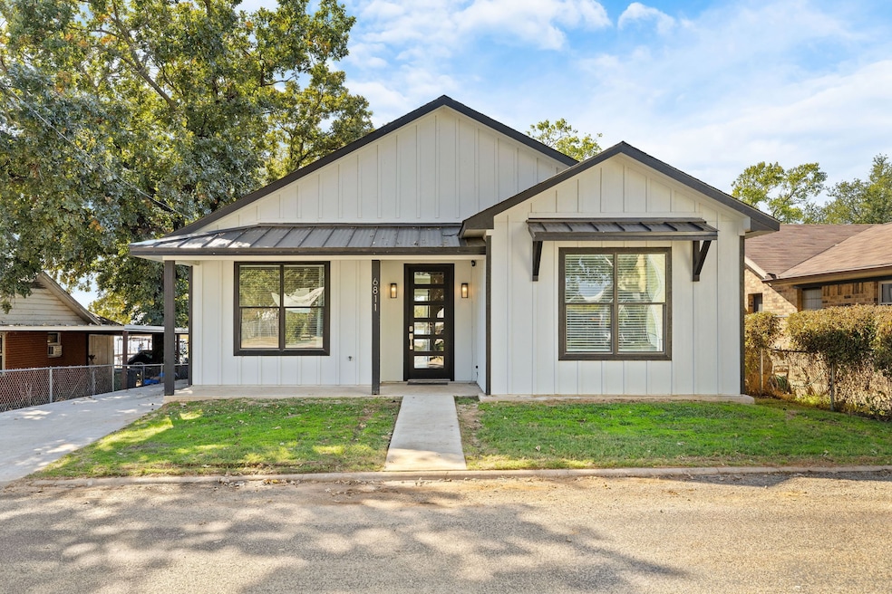 View of front of property featuring board and batten siding, a standing seam roof, a metal roof, and a porch
