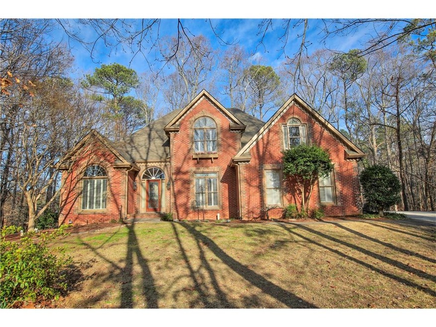 Four sides brick home on a private 1+ acre lot