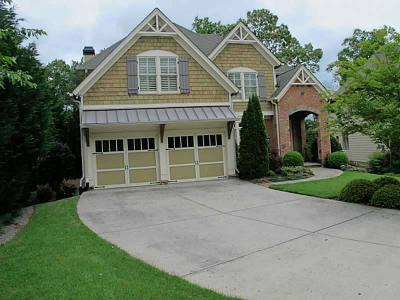 Exterior Front. Immaculate brick, stone, and cedar