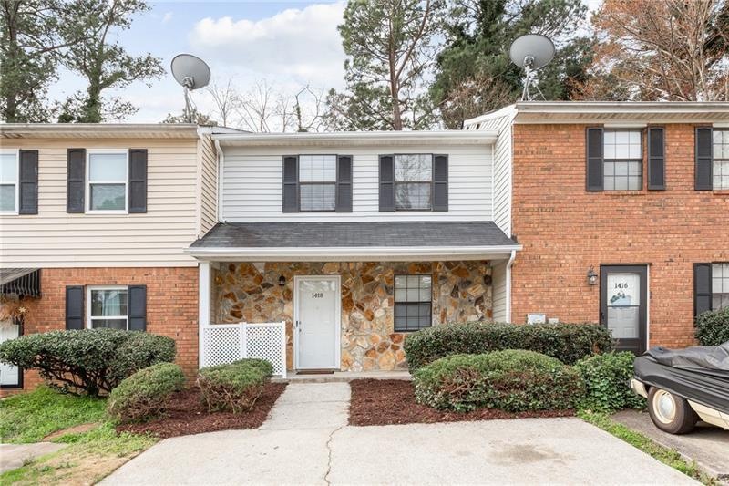 Remodeled townhome. Note overhang over the front d