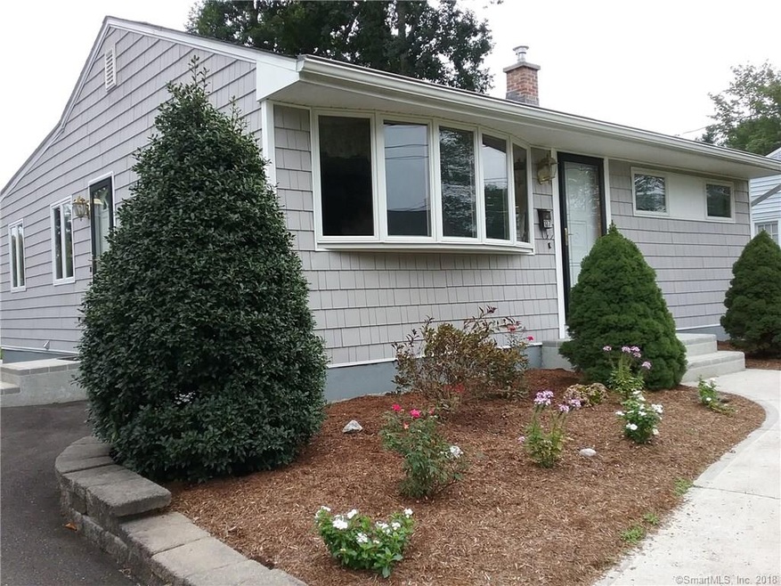 Exterior front on driveway side.