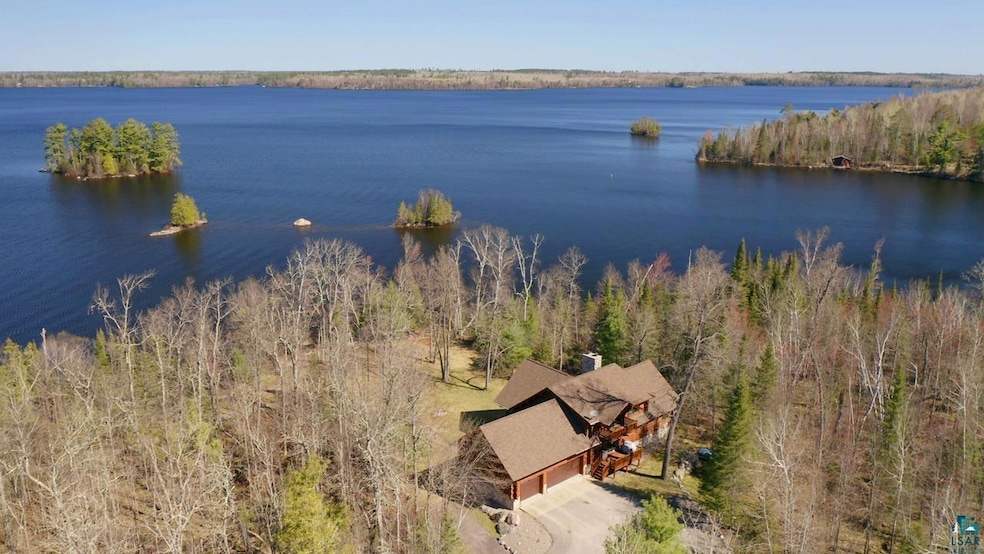 Aerial view of property and surrounding area with 