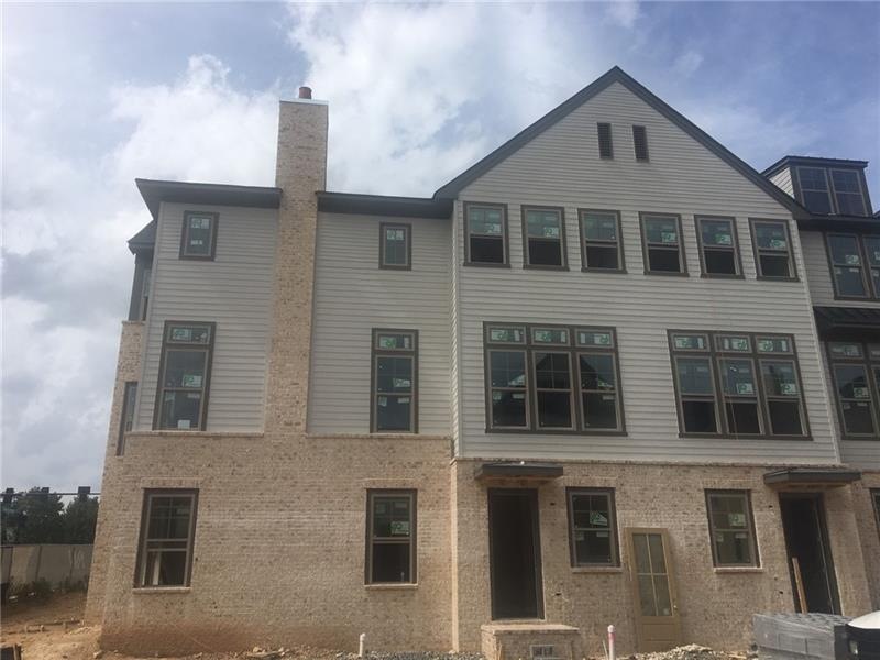 Townhome exterior. Door in the middle of this pict
