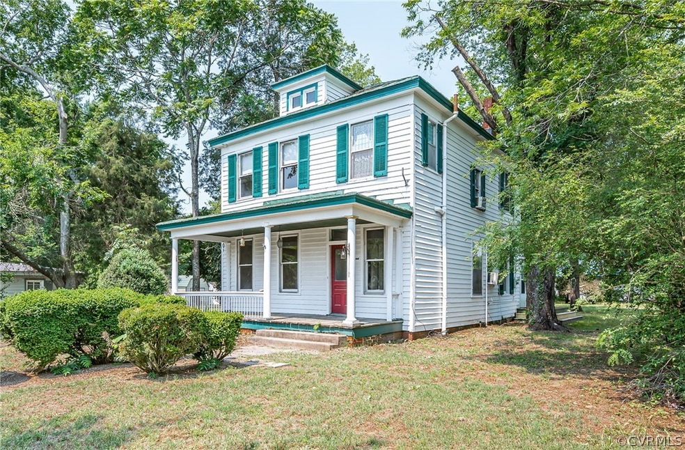 View of front facade featuring a porch and a front lawn
