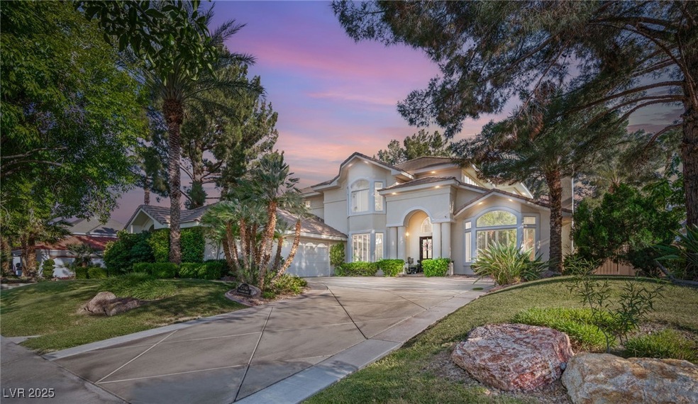  concrete driveway, stucco siding, a garage, and a