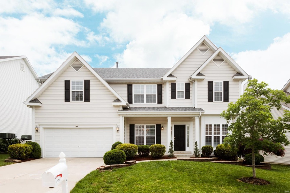 Fabulous curb appeal with vinyl siding and beautif