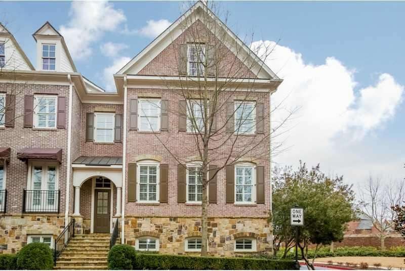 Exterior Front. Brick with Stone Accents. Covered 