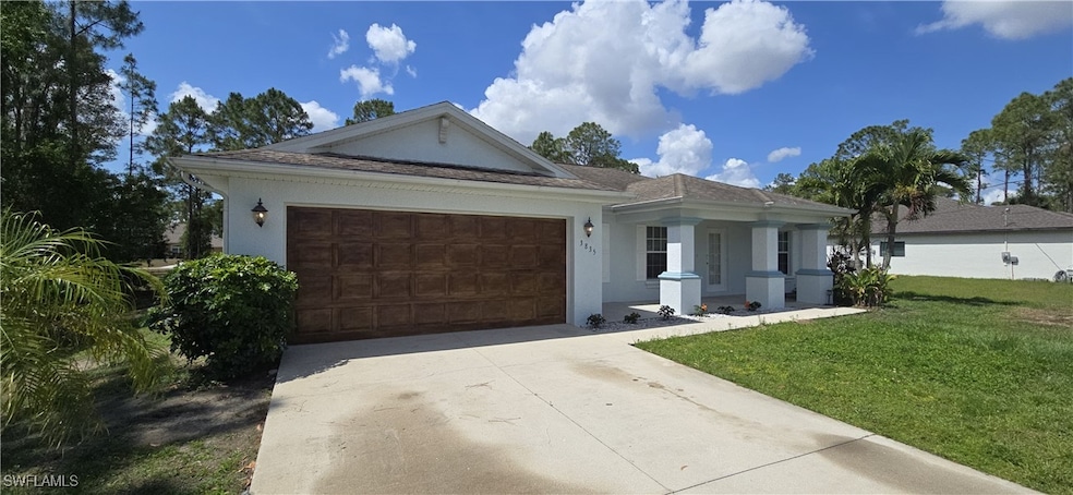 Ranch-style house featuring concrete driveway, a f