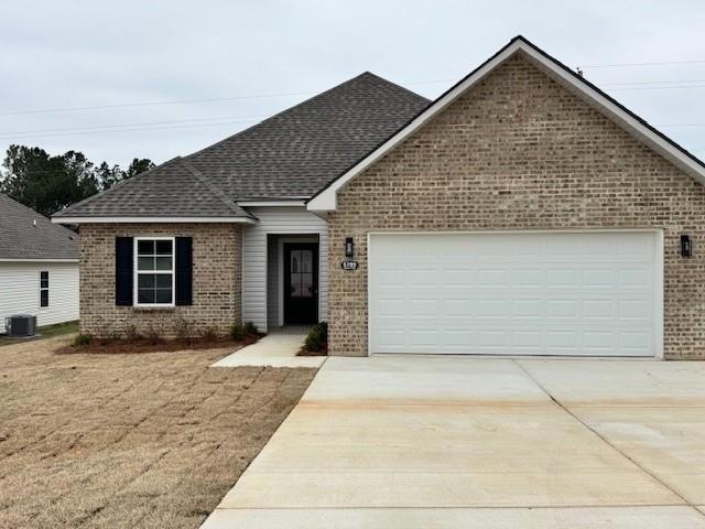 Single story home featuring roof with shingles, br