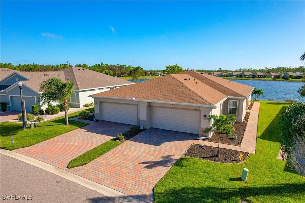 Single story villa with a 2 car garage and water v