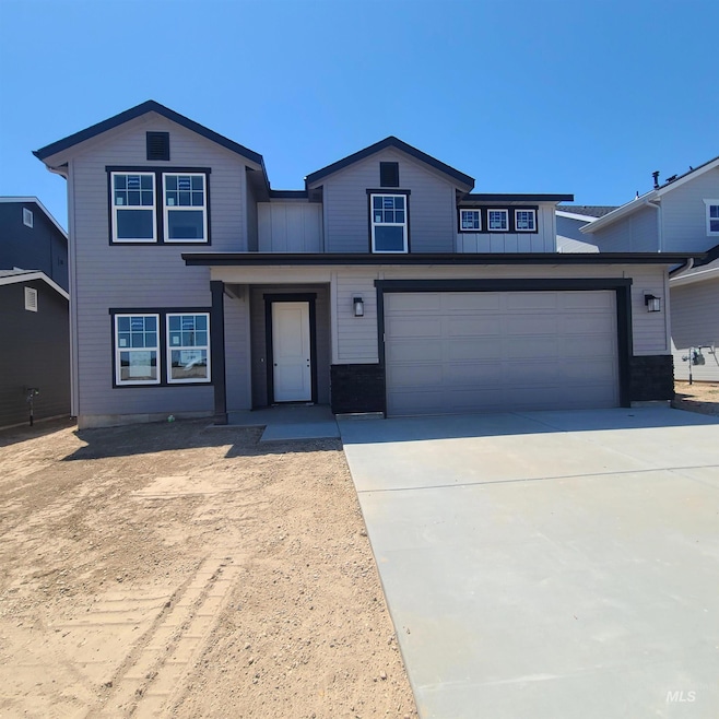 View of front of home featuring concrete driveway