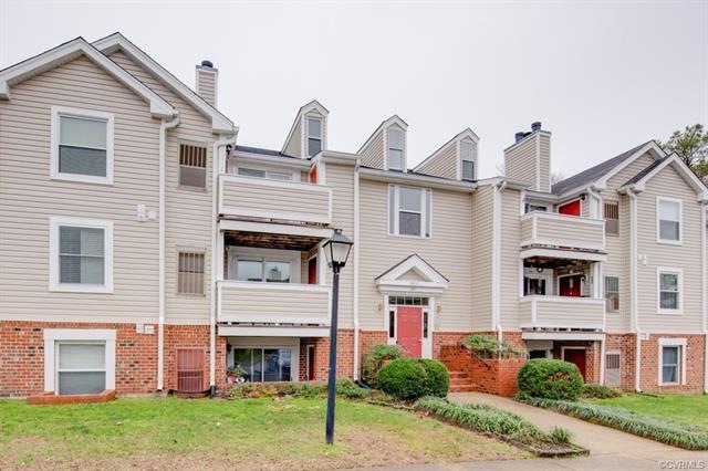 Front view of condo. Unit is ground level to the r