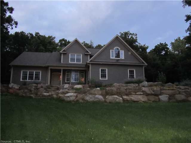 Exterior Front. Front view with rock garden