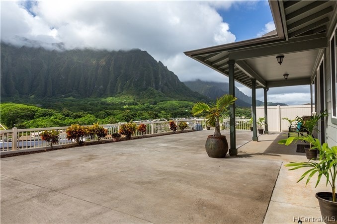 Backyard View of the Spacious Yard and Covered Lan