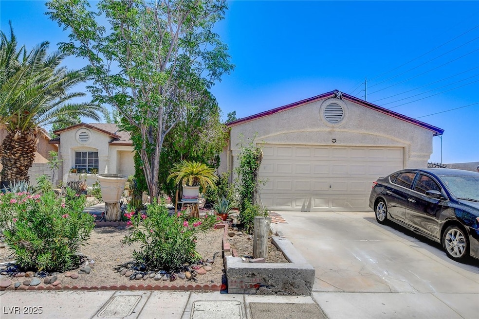 View of front facade with concrete driveway, an at