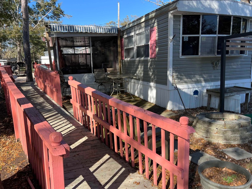 View of property exterior featuring a deck