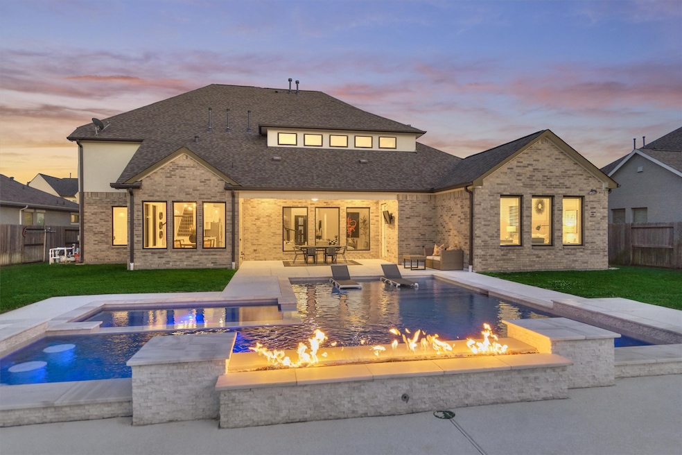 Fabulous backyard awaits you!  Sleek and modern geometric pool with oversized spa and firewall!