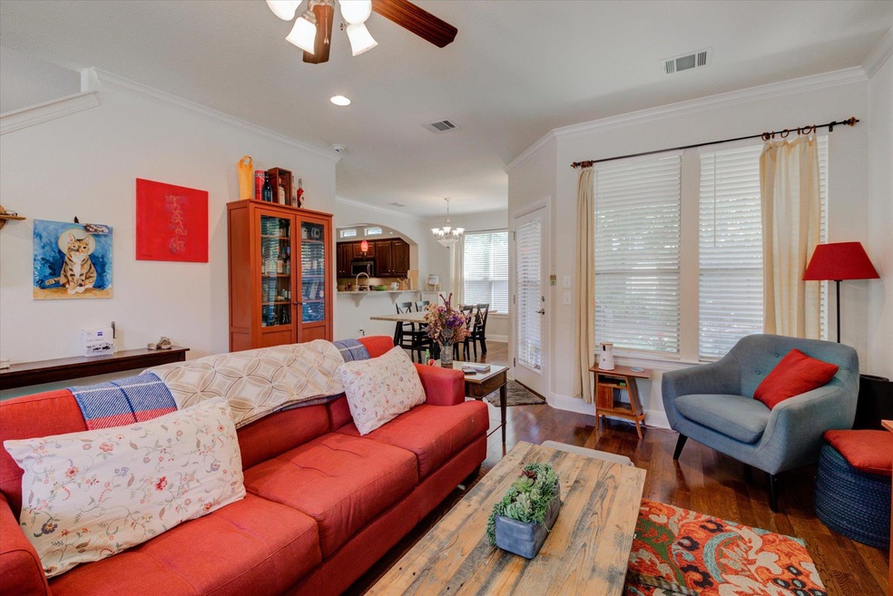 Living room with wood finished floors, ornamental