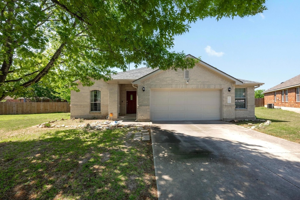 Single story home featuring fence, a front lawn, 