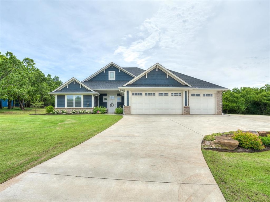 View of front of home featuring driveway, a front 