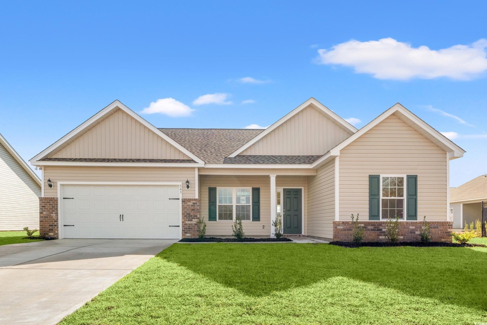 Craftsman-style home with a front yard and a garage