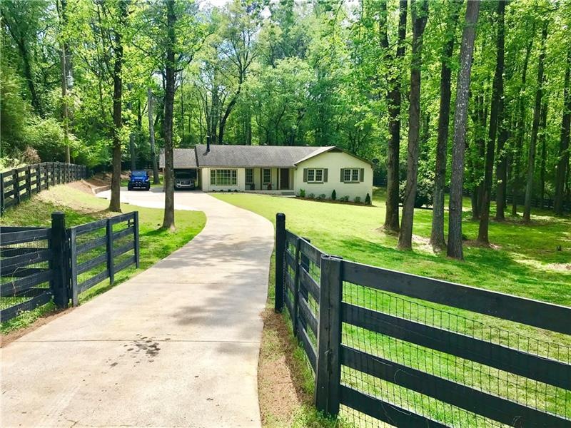 Gated drive way, home sits well off the road.