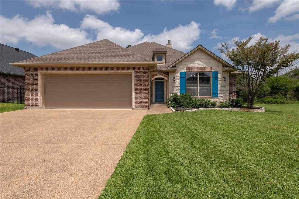 View of front of property with a shingled roof, co
