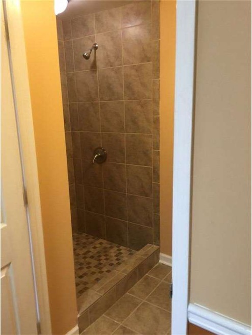 Tiled showers in both bathrooms