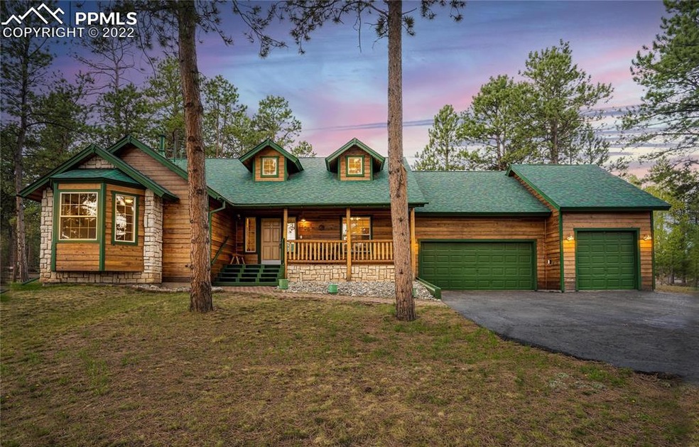 Beautiful home nestled in the trees. Large covered
