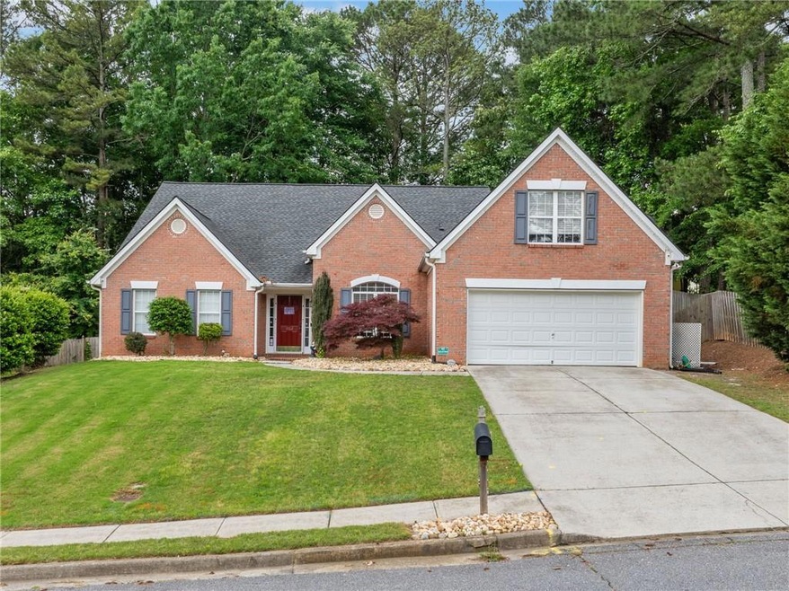 Brick front with three sides vinyl siding.