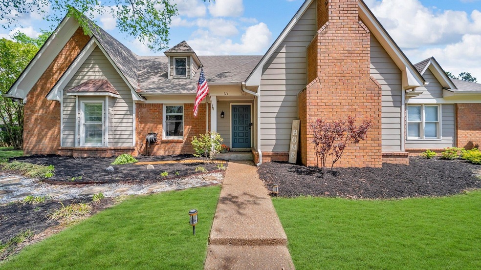 View of front of house with brick siding, roof wit