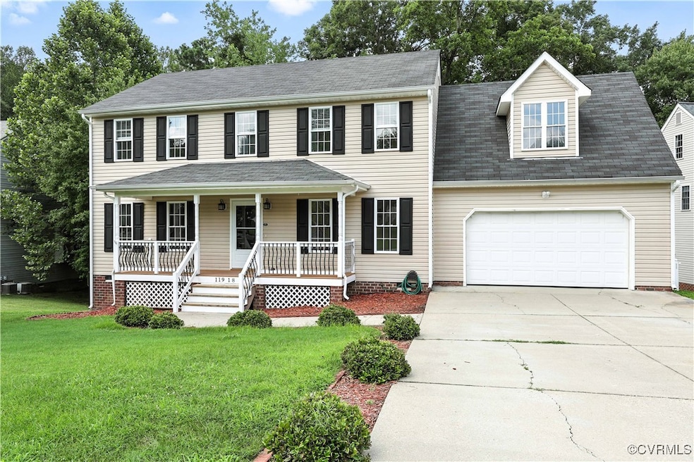 Colonial home with a porch, and an attached 2-Car