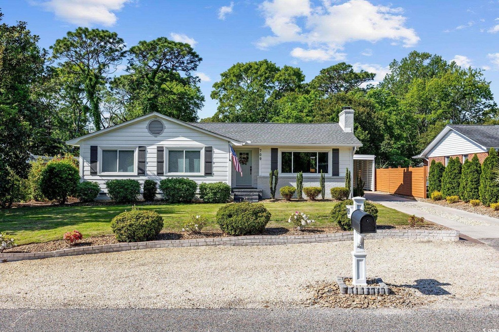 Single story home with fence, a chimney, and a fro