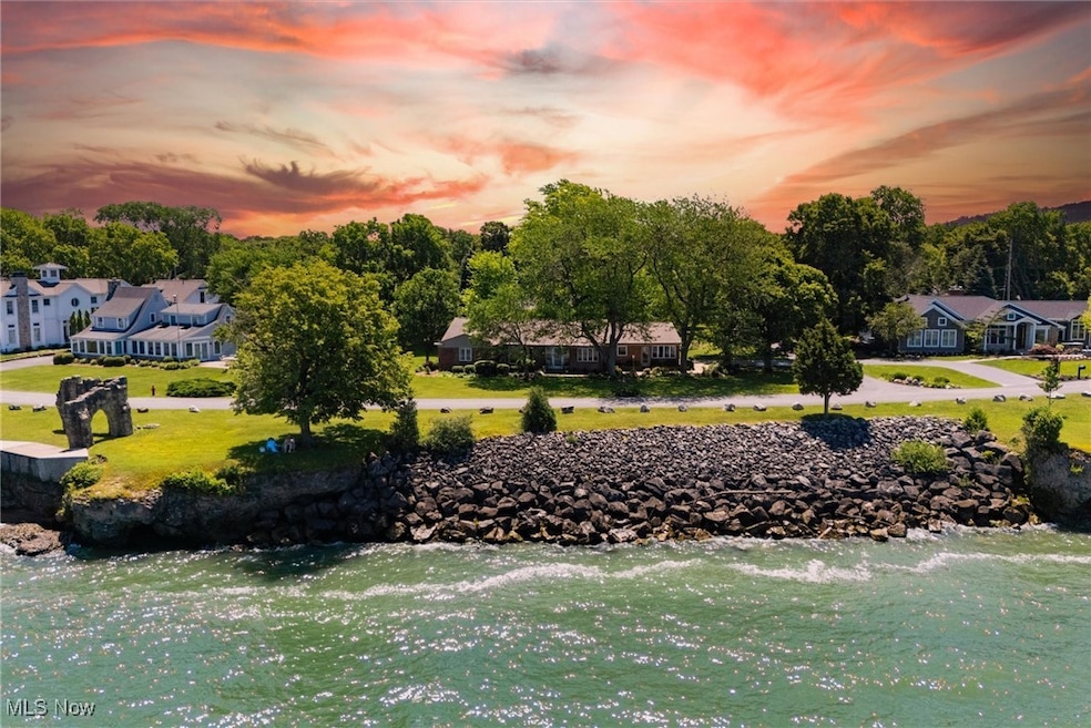View of community with a water view, a lawn, and a residential view