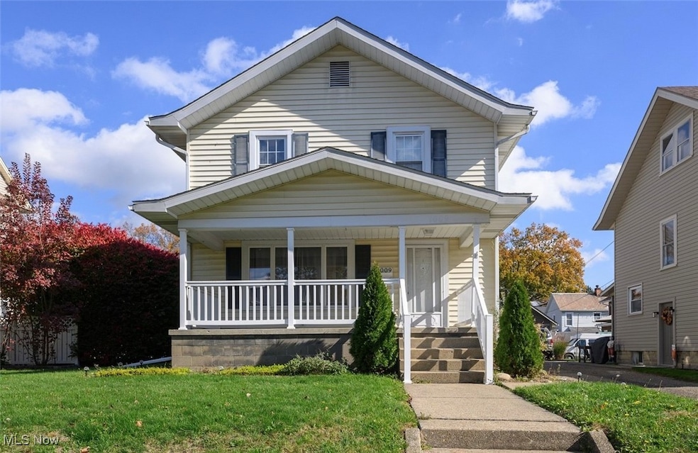 View of front of home featuring a front lawn and a porch