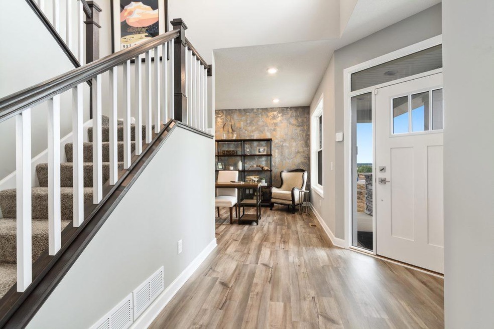 Impressive two story foyer makes for a great first impression.  Photo is of a previously built home, colors and finishes may vary.