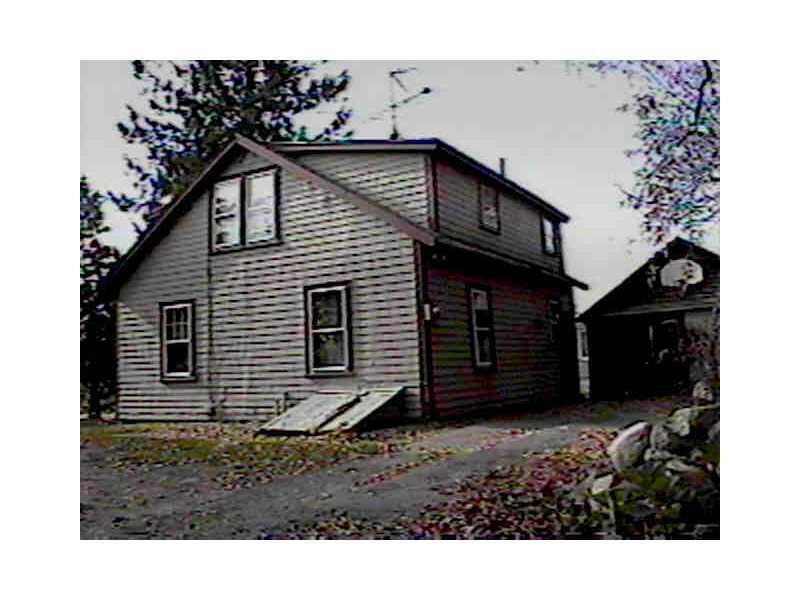 Exterior Front. Main house, Driveway and Garage