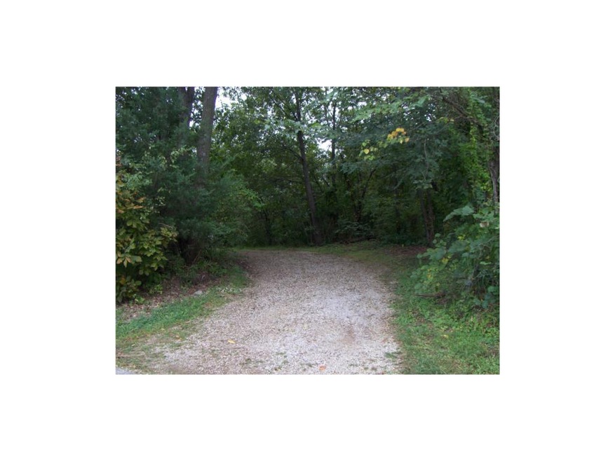 Graveled entrance to property